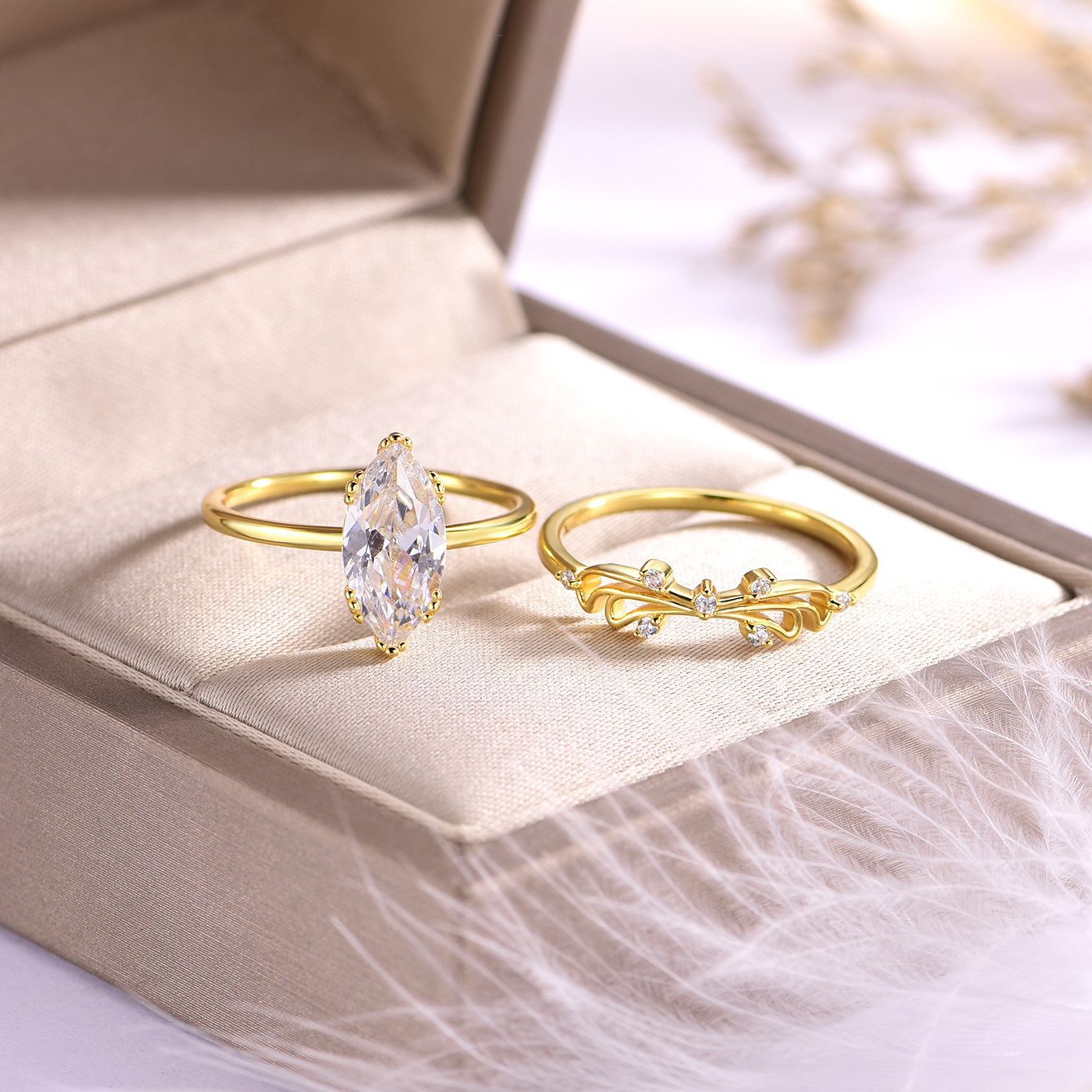 Gold-plated moissanite ring set with marquise solitaire and vine-inspired accent ring