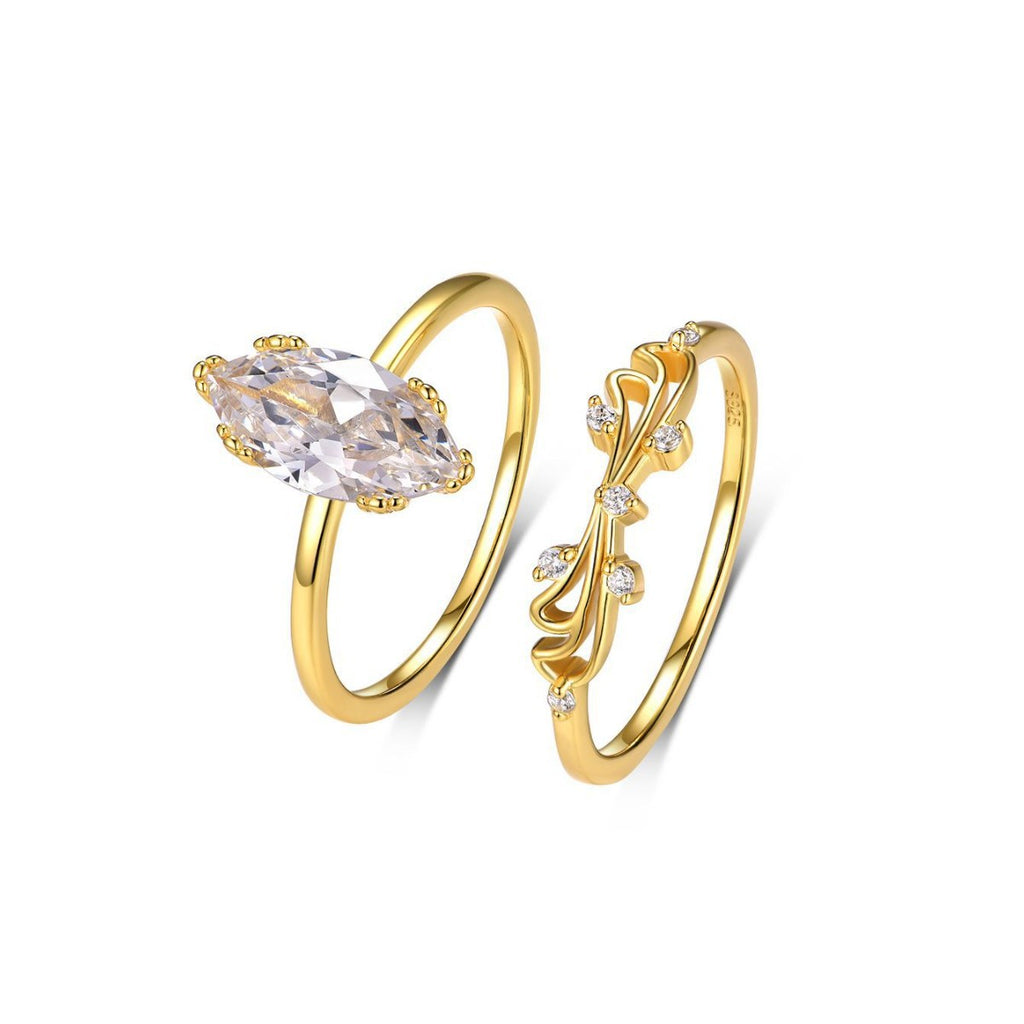 Gold-plated moissanite ring set with marquise solitaire and vine-inspired accent ring